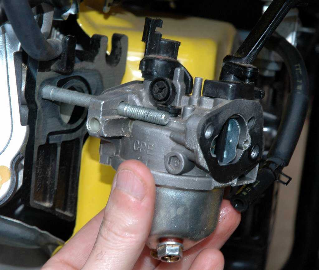 Worn or damaged carburetor components: